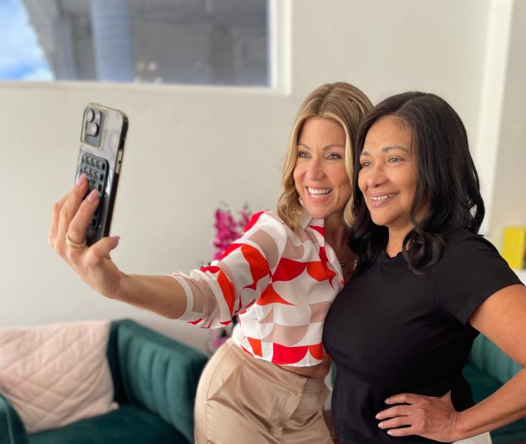 Maria Marin taking selfie with follower in one of Paula's human hair wigs in Miami
