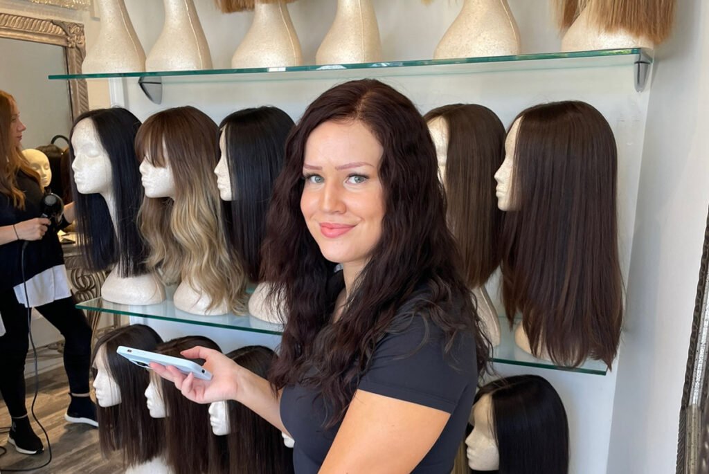 A woman wearing a natural hair wig in Paula's Miami store